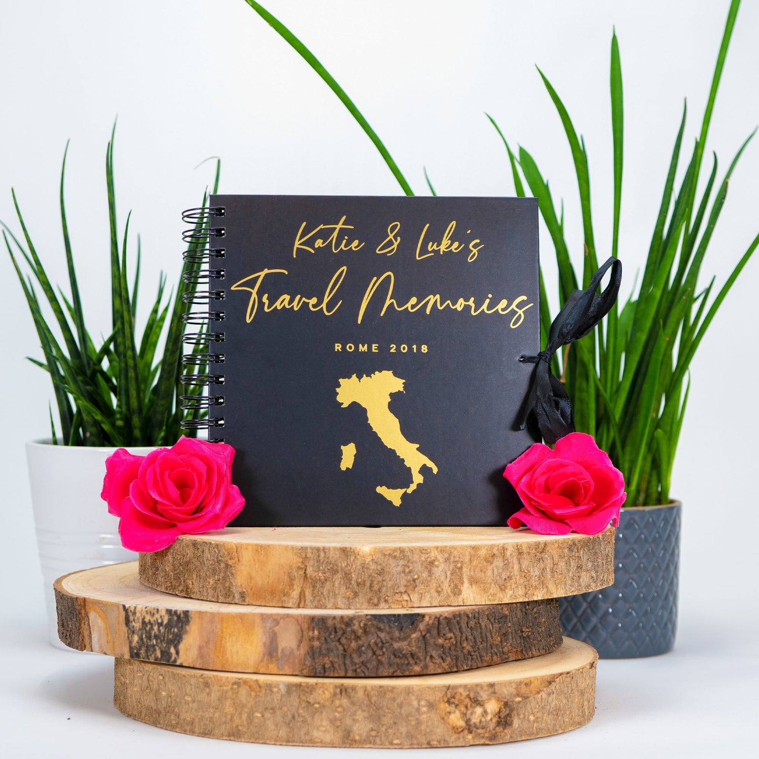 black scrapbook with italy map on the front