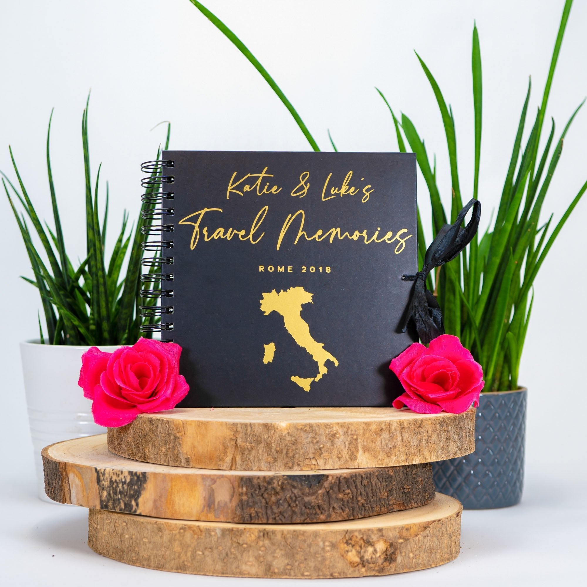 black scrapbook with italy map on the front