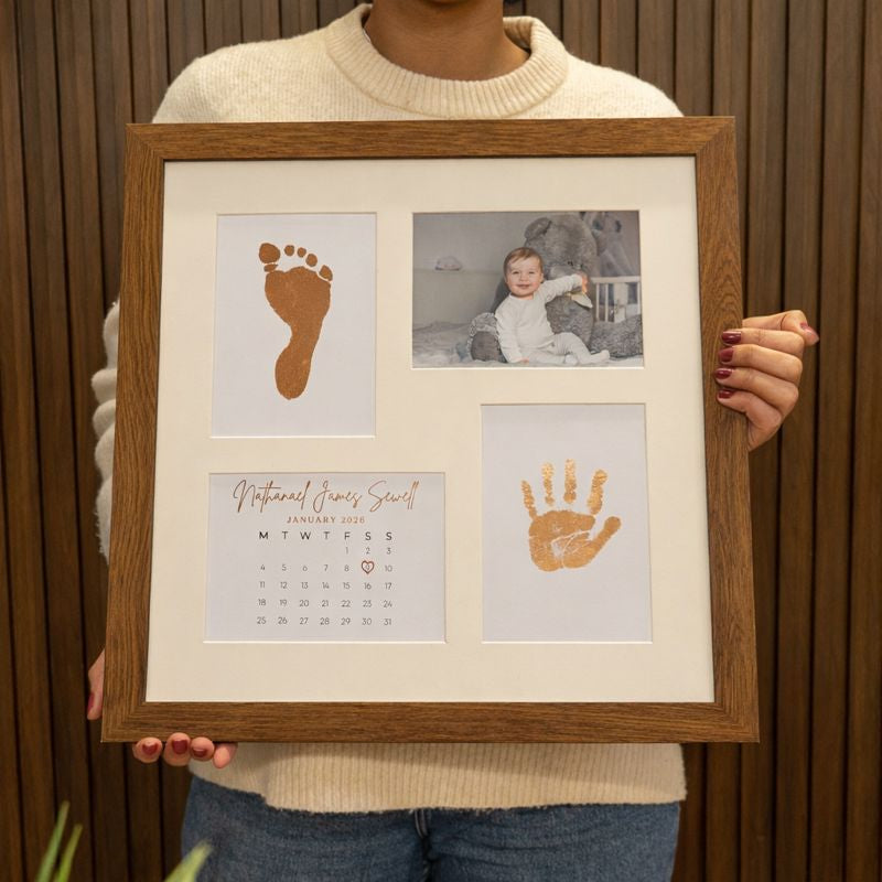 Luxury baby keepsake frame featuring gold foil handprint and footprint with ultrasound photo and birth calendar