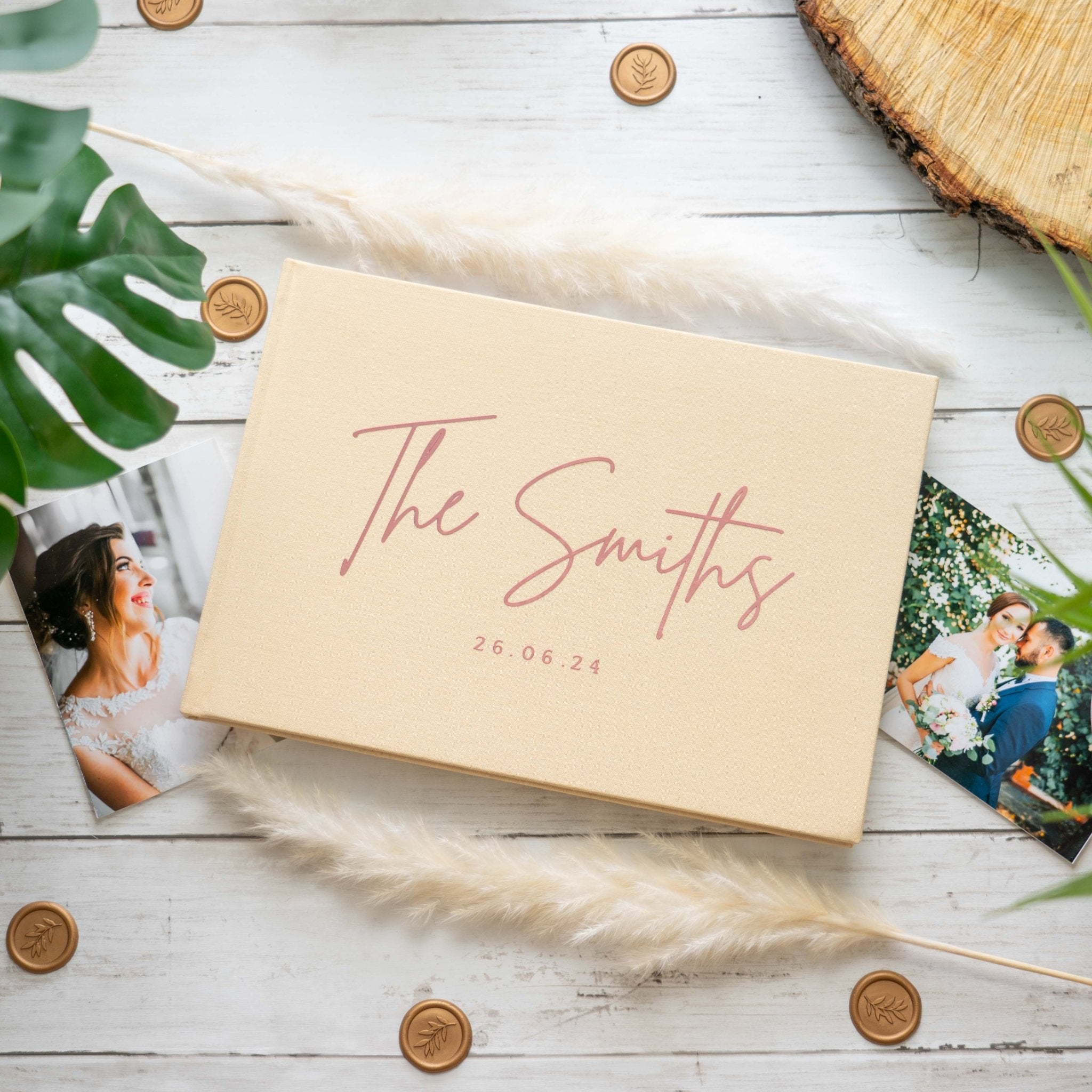 Elegant wedding guest book displayed on reception welcome table