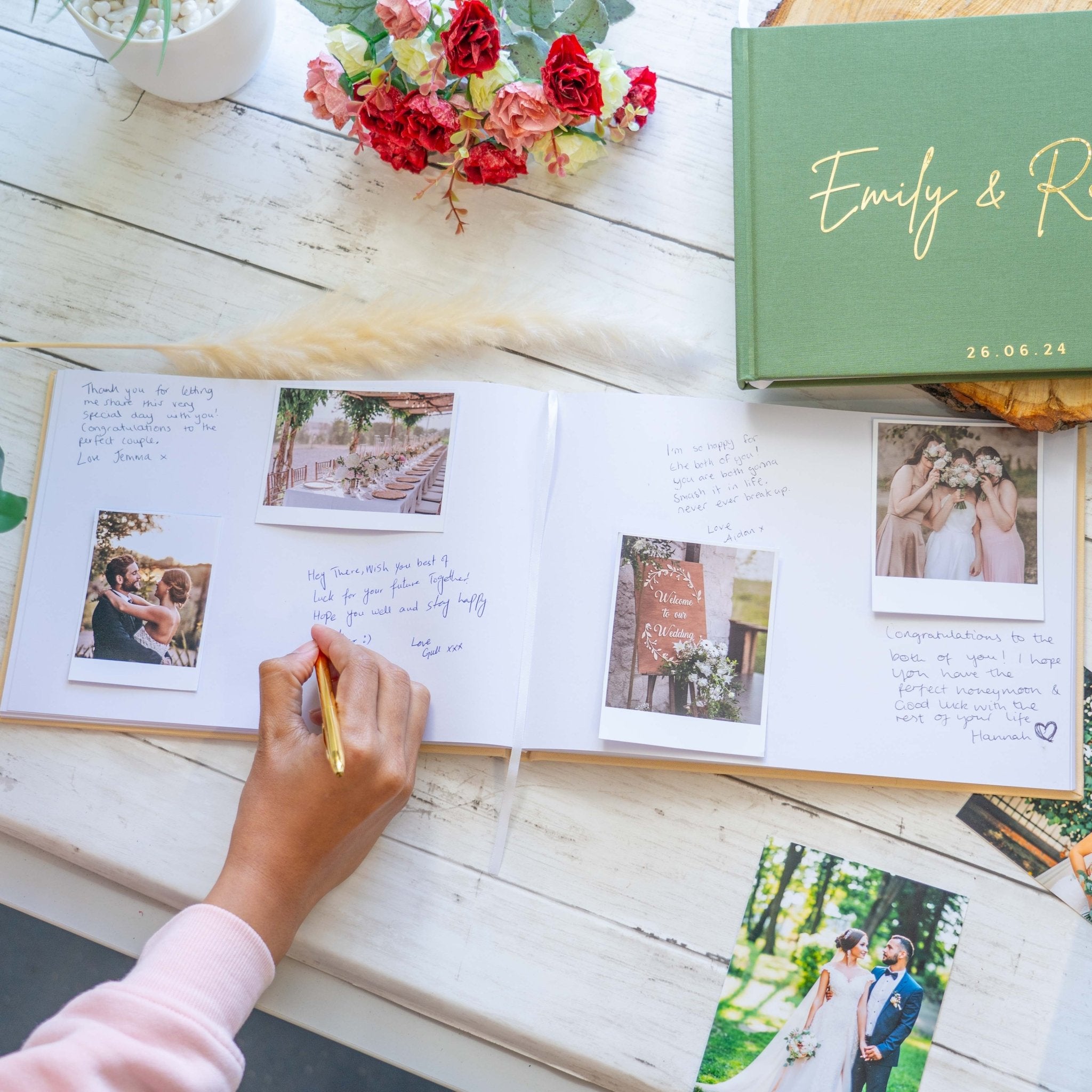 woman writing inside a wedding guest book with polaroids