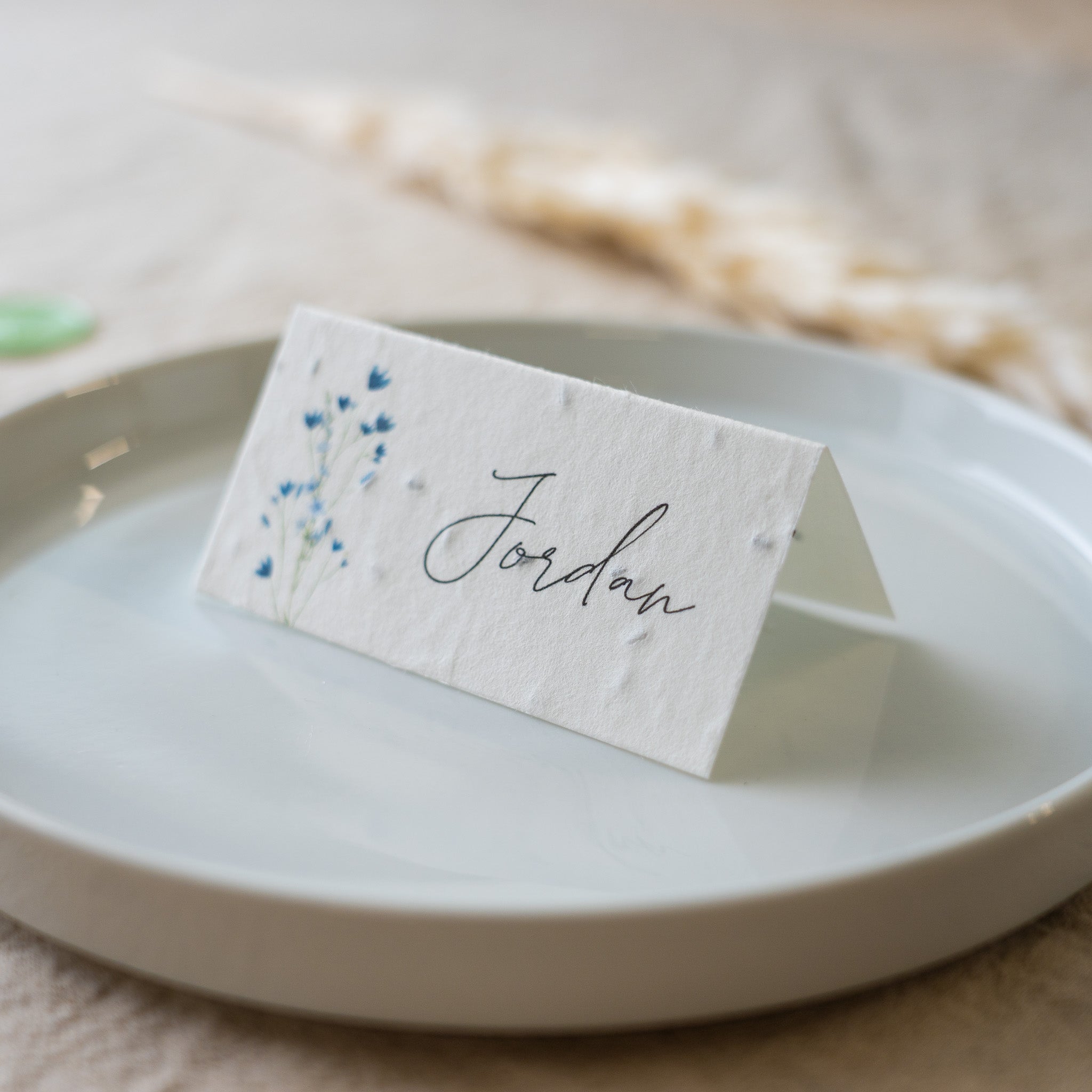 Place card with 'Jordan' on a white plate