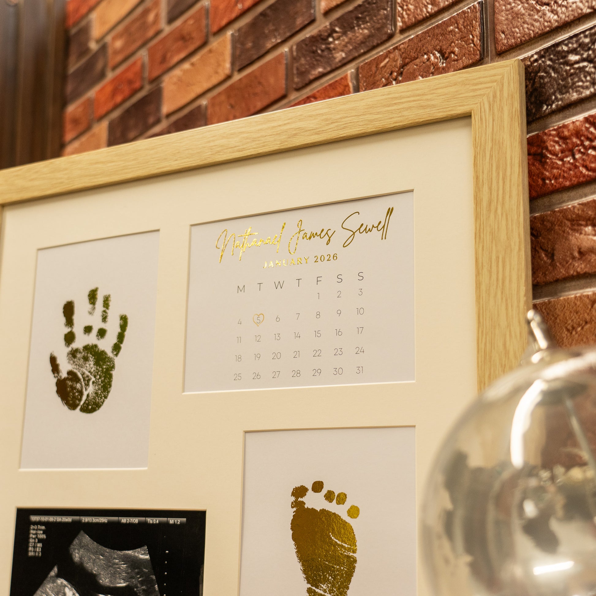 Nursery decor baby foil frame with ultrasound image, metallic gold handprint and footprint