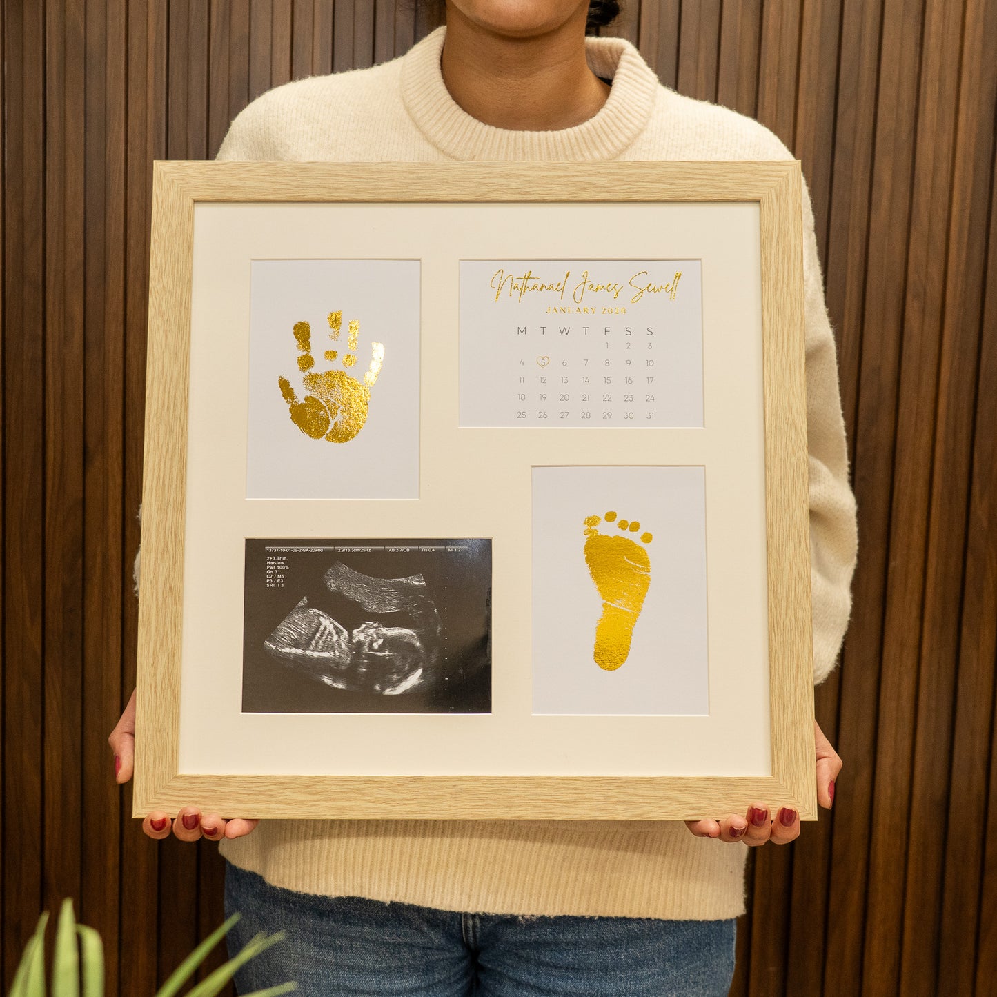 Personalised baby foil photo frame with gold handprint, footprint and ultrasound scan displayed in wooden frame