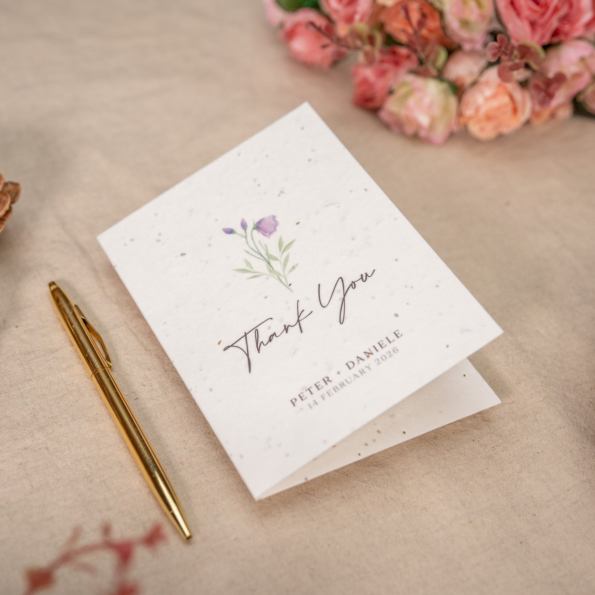 Sustainable seeded wedding thank you cards with delicate floral design on plantable paper