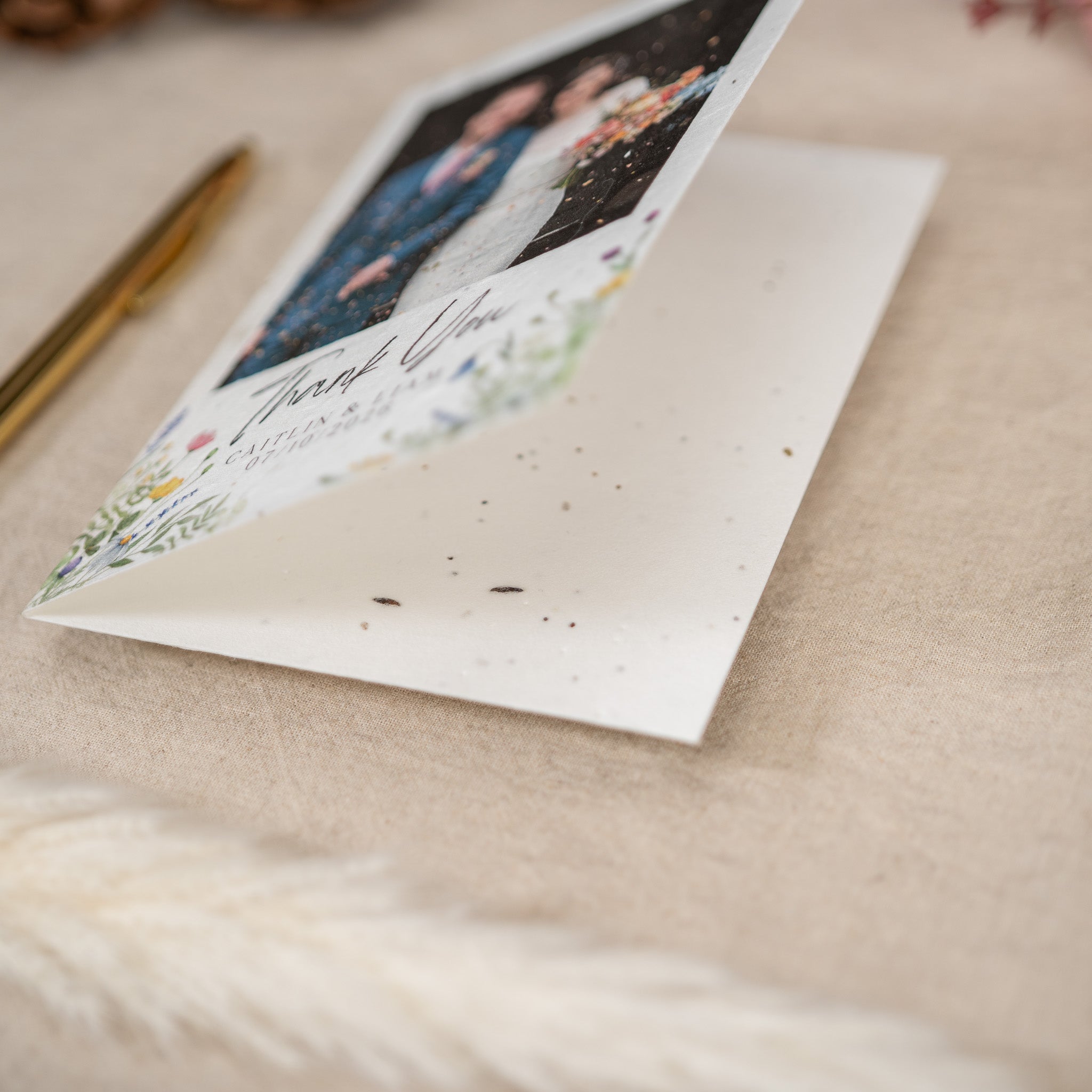 A close up of a wedding thank you card made of biodegradable seeded card