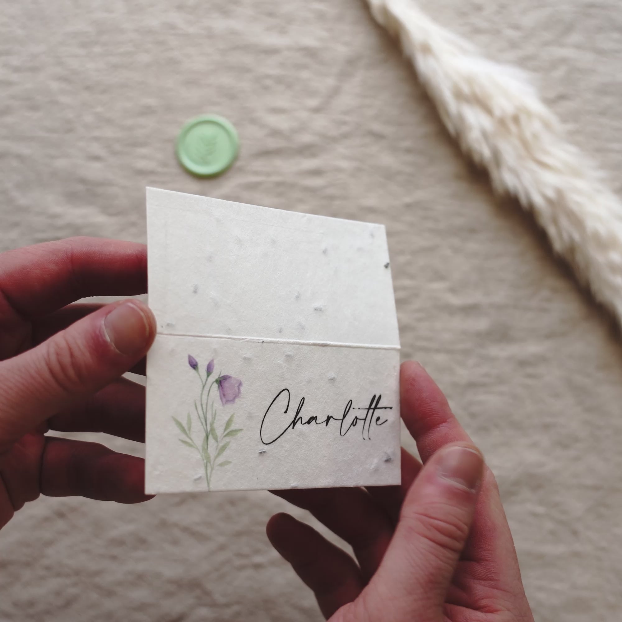 Load video: seeded paper name cards for wedding